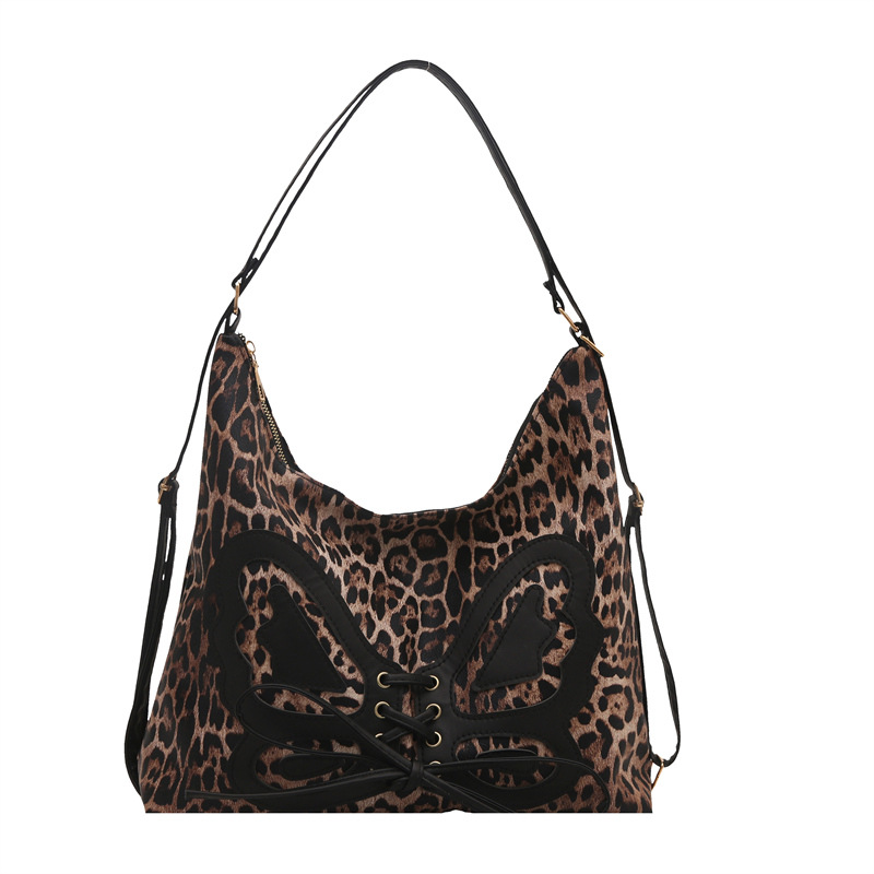 Mochila de arco de gran capacidad para mujeres 2025 primavera nueva mochila retro textura de viaje elegante bolsa de mano