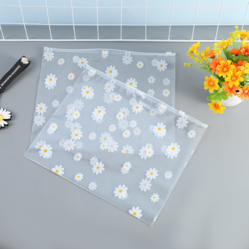 Bolsa con cremallera de ropa Bolsa con cremallera de crisantemo pequeño Bolsa de embalaje de camiseta Bolsa de ropa interior Bolsa de ropa PE esmerilada pequeña bolsa ziplock