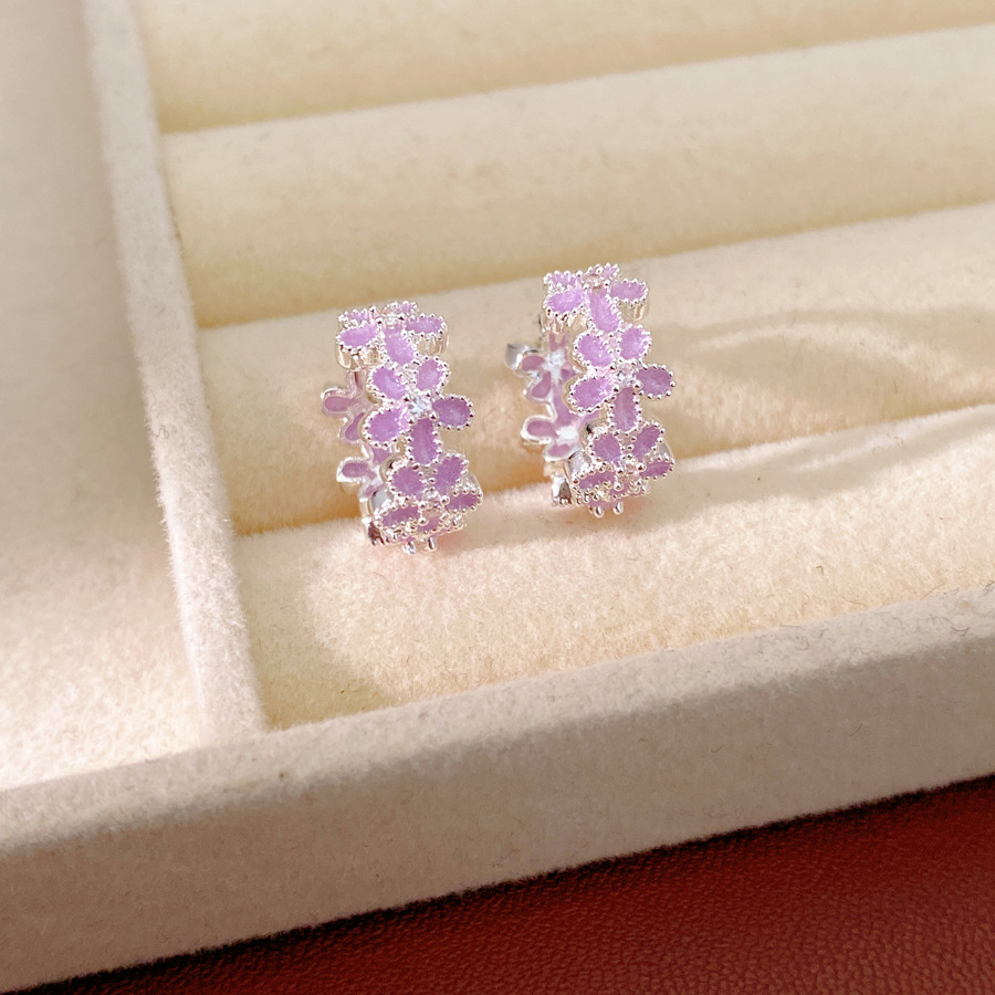 Dopamina color zircón goteo flor aretes redondos frescos aretes dulces lujosos alta sensación auriculares al por mayor