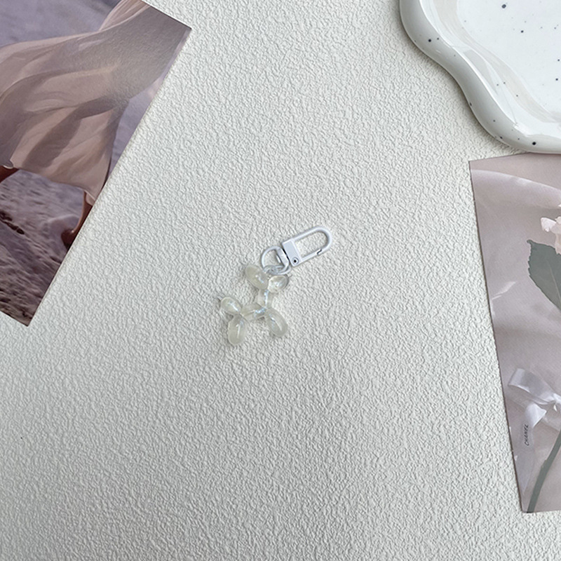 Pequeño Libro Rojo mismo lindo jalea globo láser perro llavero colgante colorido cachorro de dibujos animados teléfono llavero