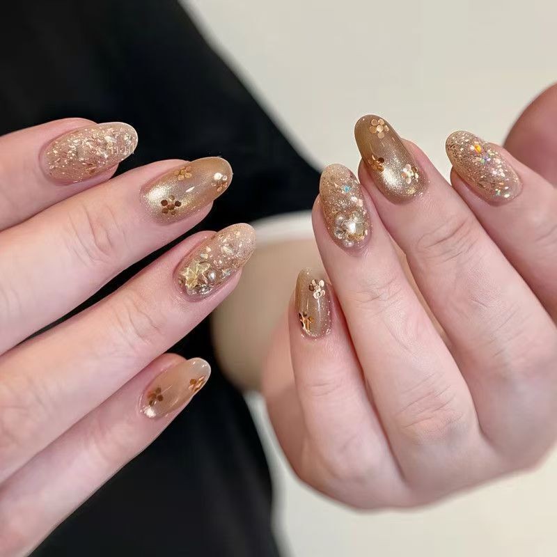 Milk tea cat-eye, handmade nail art with small floral sequins, shimmering and dazzling, gentle and elegant, perfect for Instagram, and ideal for students