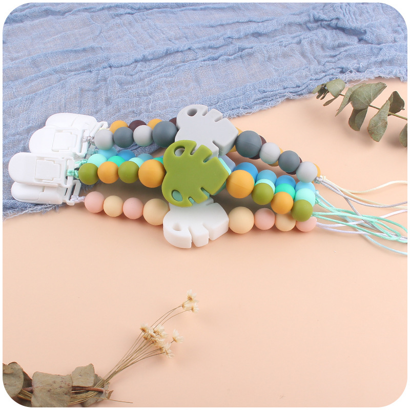 Suministros para bebés chupete cadena creativa bebé dibujos animados hojas silicona mordedura cadena anti-gota molar Nuevo