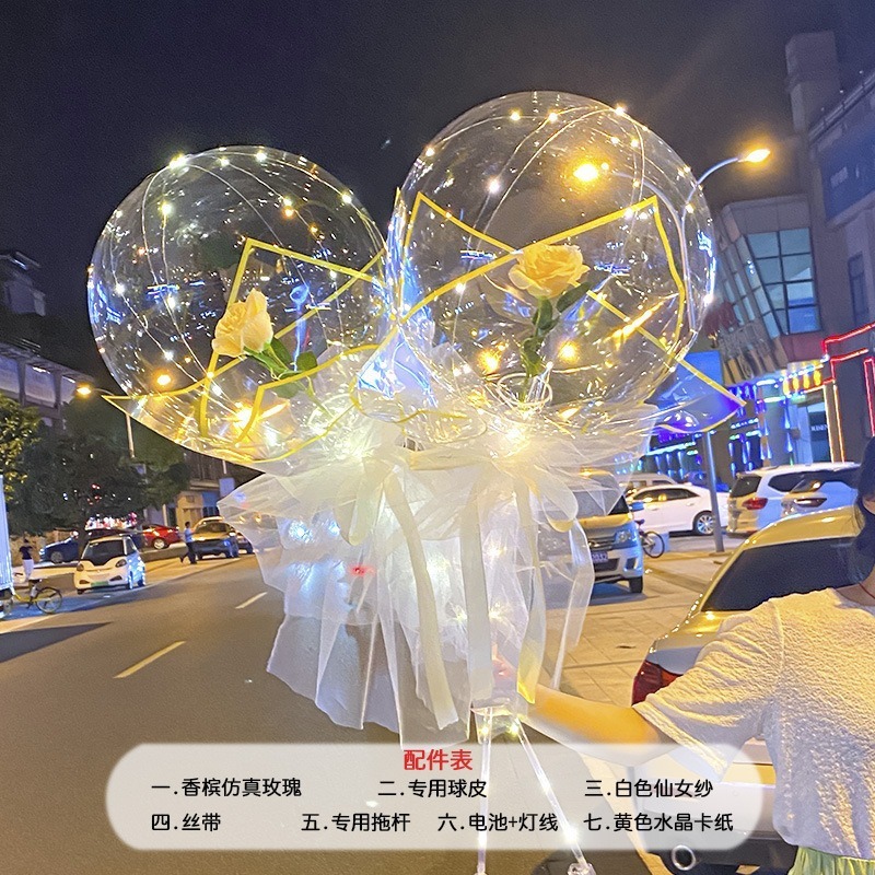 光る夜市の円形の赤い屋台のネットを並べてボールを押して会の風船のイルミネーションの明かりの告白のロマンチックな波の地帯のスーツを押します。|undefined