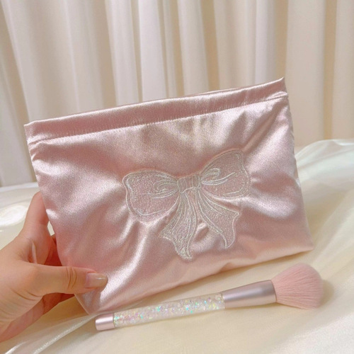 Fresh embroidered bow portable cosmetic bag, portable large-capacity liner storage bag, niche cloth