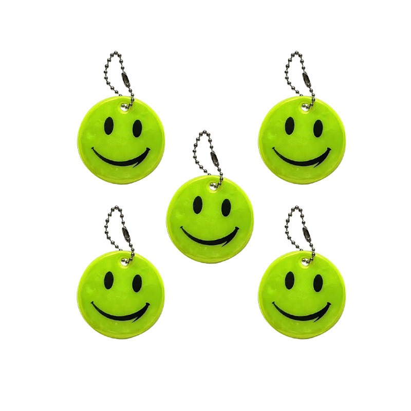 Colgante reflectante sonriente para niños viajar por la noche PVC seguro al aire libre