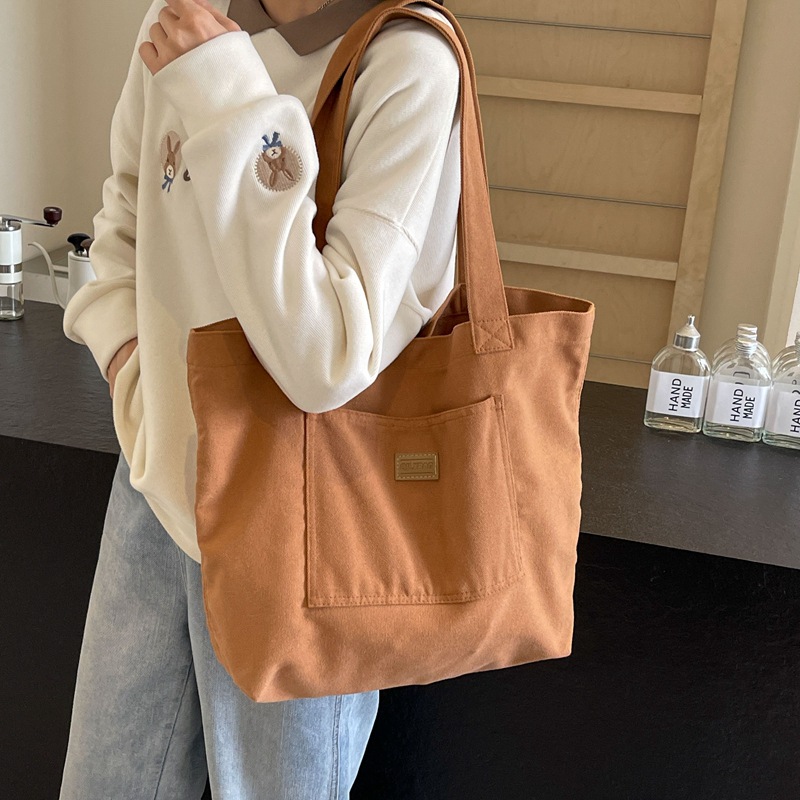 Bolso de lona para mujer 2024 nuevo bolso de hombro de gran capacidad de color sólido casual simple y versátil bolso de clase al por mayor