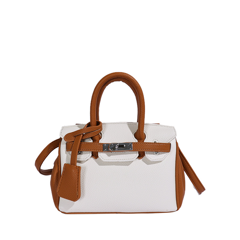 Bolso de platino portátil de litchi para mujeres 2026 comercio exterior nuevo estilo de alto nivel de sensación de tamaño de estilo de hombro mochila