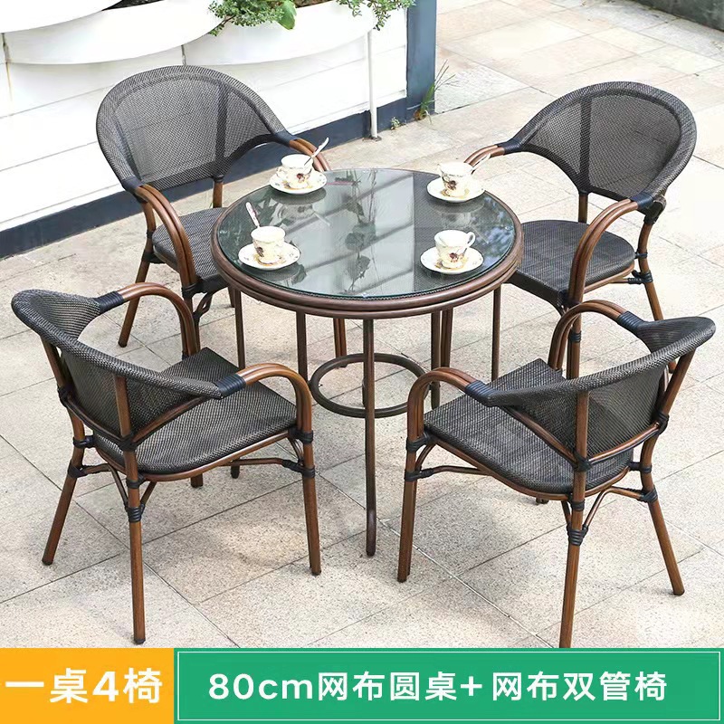 Mesa y silla al aire libre leche tienda de té cafetería silla de malla Silla de ratán Patio de tres piezas balcón mesa y silla de ocio al aire libre