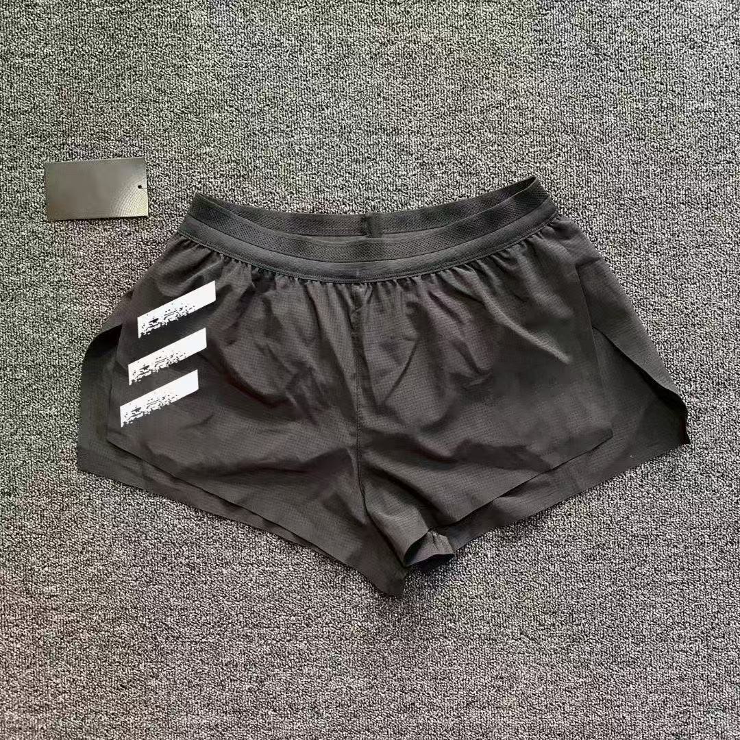 スポーツランニング三分トレーニングパンツ男性プロマラソン側開帯ライニング速乾通気陸上パンツ