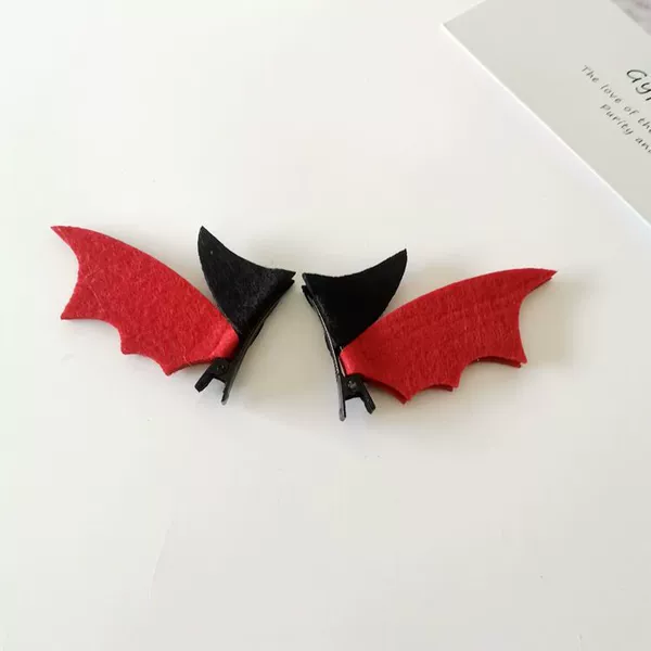 A pair of black horn red wing hairpins