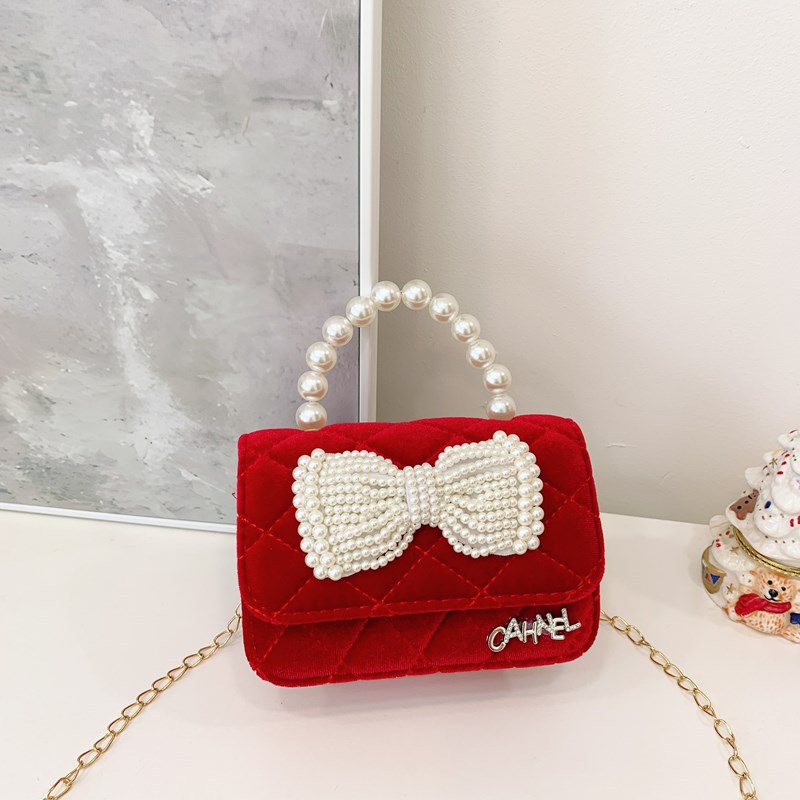 Bolso de niños nuevo bolso de perla rojo de Año Nuevo lindos princesas niñas bolso de hombro de cadena de estilo extranjero bolso de mochila