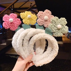 Trendy, adorable plush face-washing headband with fluffy lamb wool and delicate floral accents—Instagram-worthy, chic little hair accessory