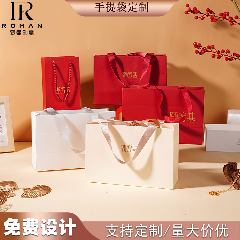 厂家直销现货潮宏基标配物料手提袋压纹UV烫金烫银加丝带高级礼袋