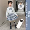 Gentle plaid skirt + Haohai long sleeves + bow tie