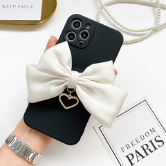 Ins-style bow airbag stand suitable for mobile phones and tablets, with heart-shaped ornament, lazy person's desktop stand, adhesive type