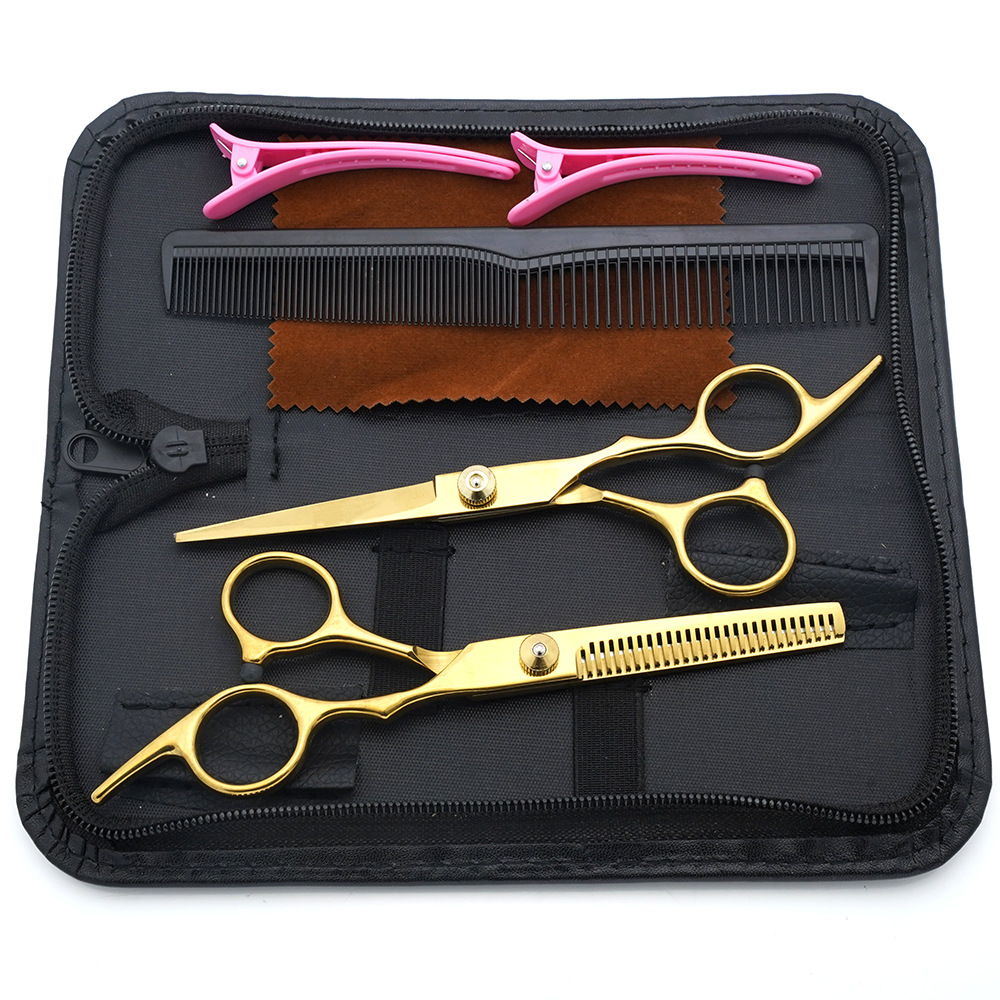 Tijeras de peluquería de 6 pulgadas, negras y doradas, con mango inclinado y de alta calidad, juego de tijeras de peluquería al por mayor para cortar el cabello.
