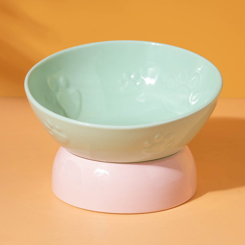 Tazón en relieve con garra inclinada con pies (tazón verde con pies rosas)