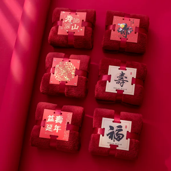 Birthday towel with hand gift red gift box with birthday banquet for the elderly
