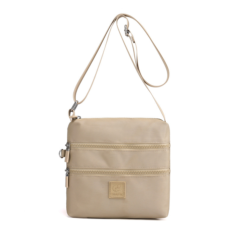 Bolsos de tela pequeños al por mayor, bolsos de nylon, bolsos de hombro para mujeres, tendencia coreana, mochilas ligeras al aire libre, bolsos de tela prácticos de varias capas