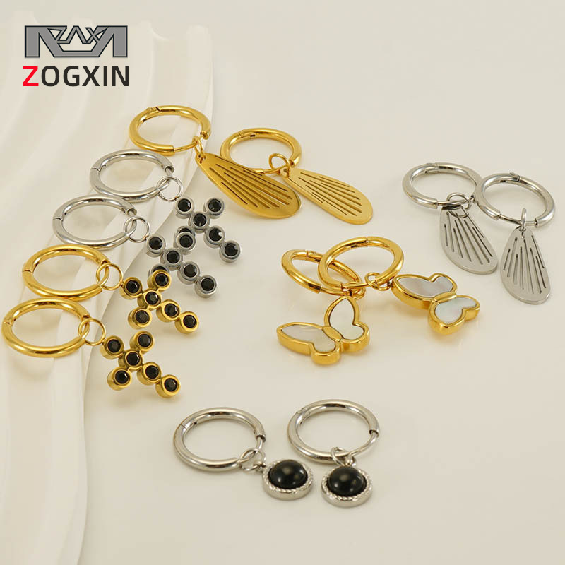 Cruz-frontera nuevo diseño de acero inoxidable hueco Alas pendientes hembra Europea y Americana nicho mariposa Cruz pendientes al por mayor