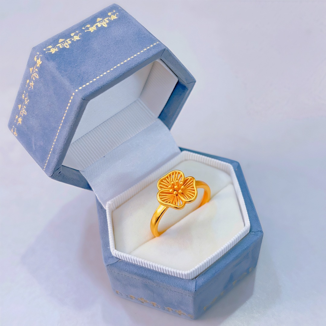 Hollow filigree three-petal flower ring