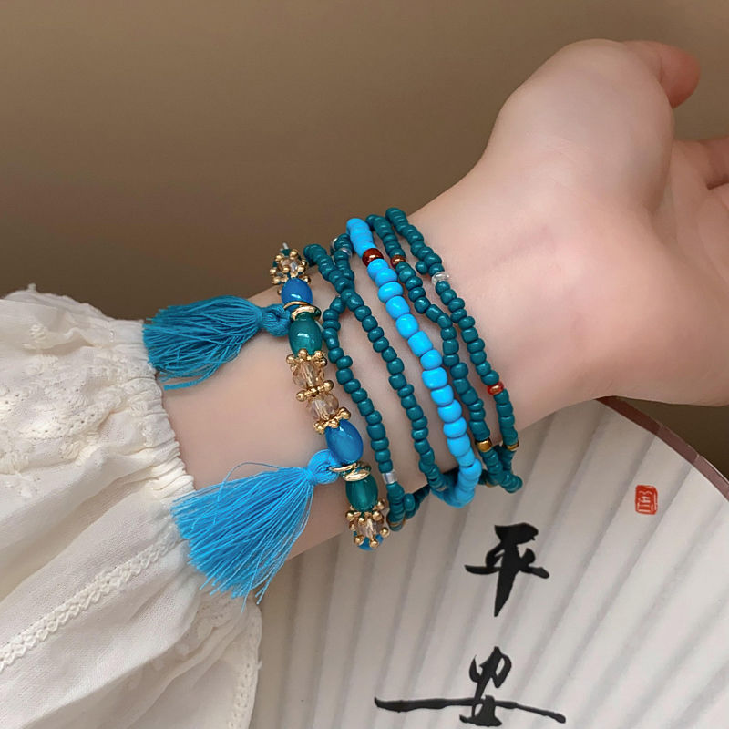 Nuevo estilo chino colorido arroz cuentas anillo campana trenzado cuerda pulsera artística retro pulsera estilo étnico todo partido pulsera para mujeres