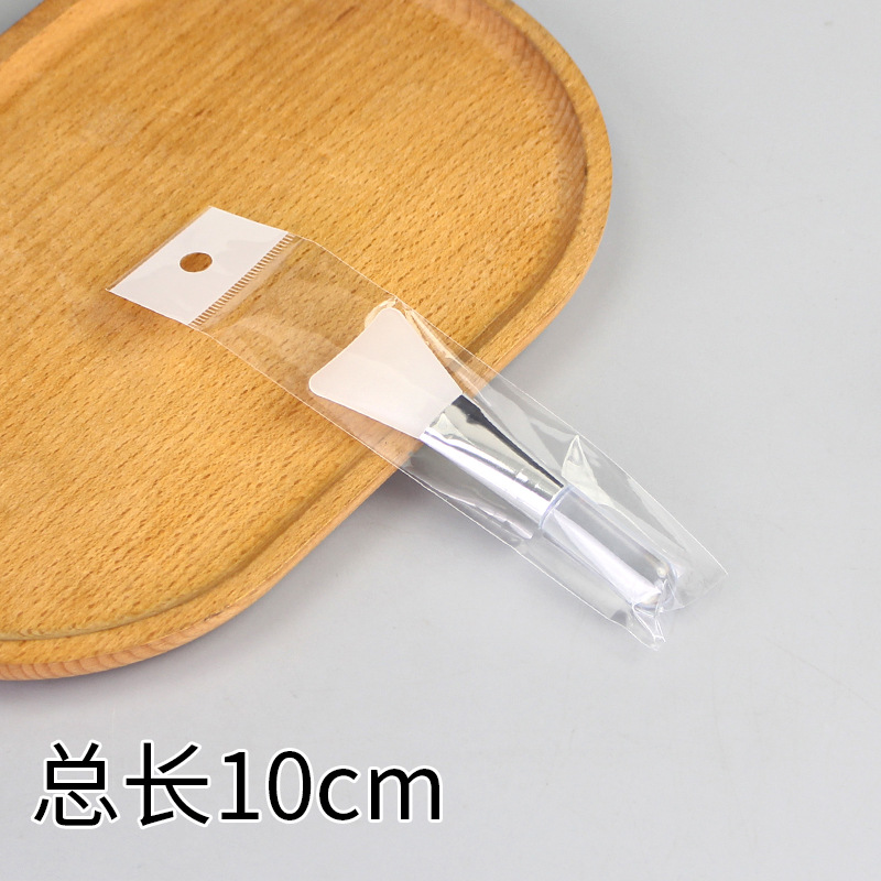 Transparent solid handle shovel-shaped soft rubber brush: Short version