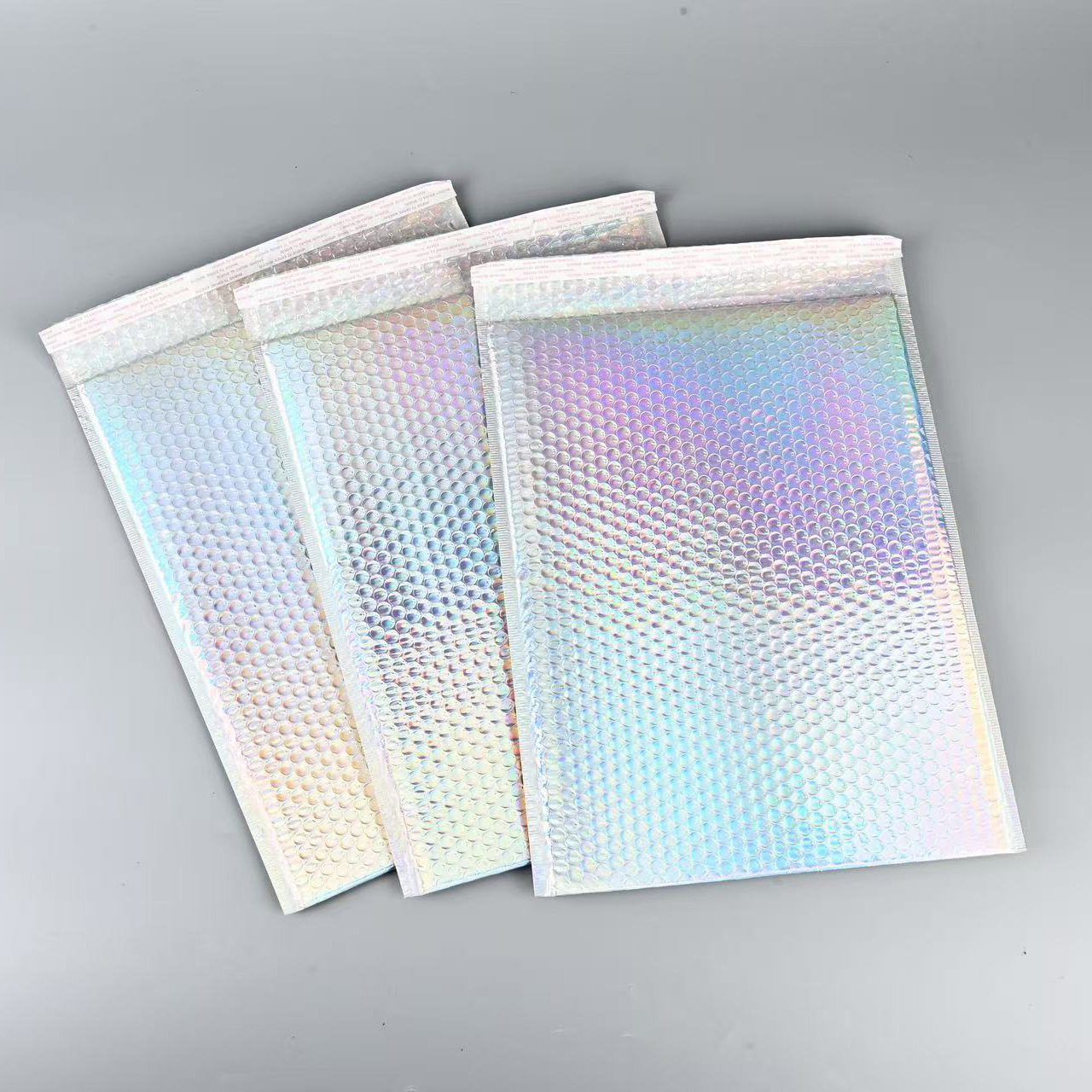 Bolso expreso de espuma de película de aluminio engrosado bolso de burbuja a prueba de golpes de color al por mayor bolsa de embalaje de ropa fabricante de bolsa de espuma engrosada