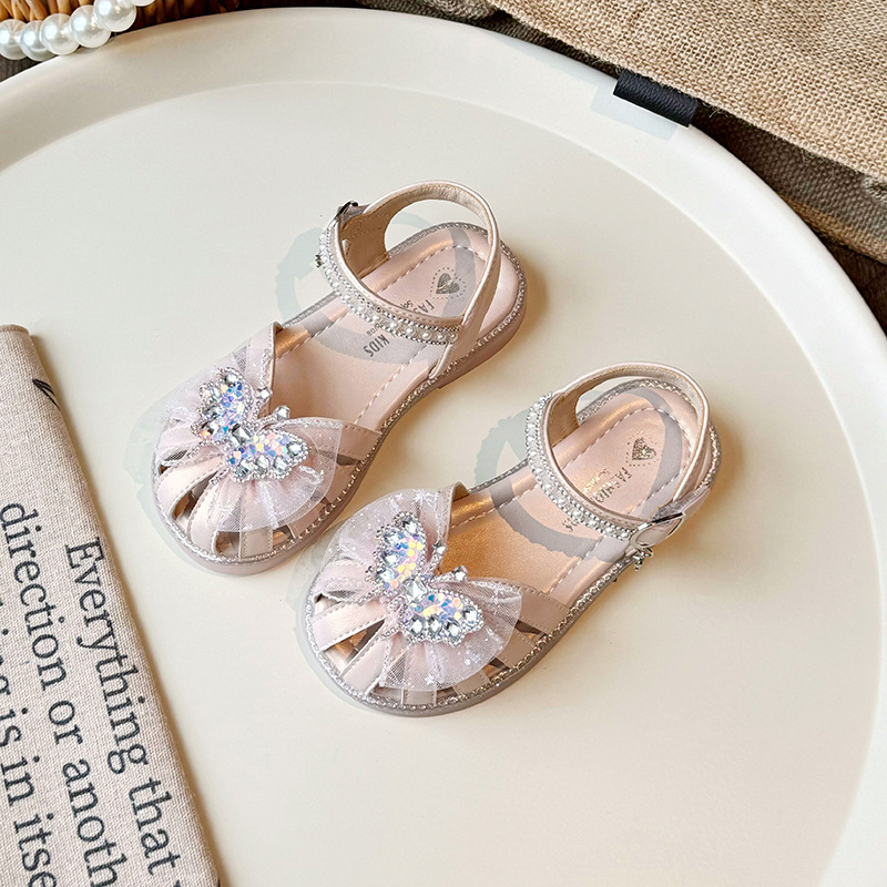 Sandálias de niñas de verano 2025, nuevos zapatos de playa para niños con suela suave, zapatos de princesa de arco