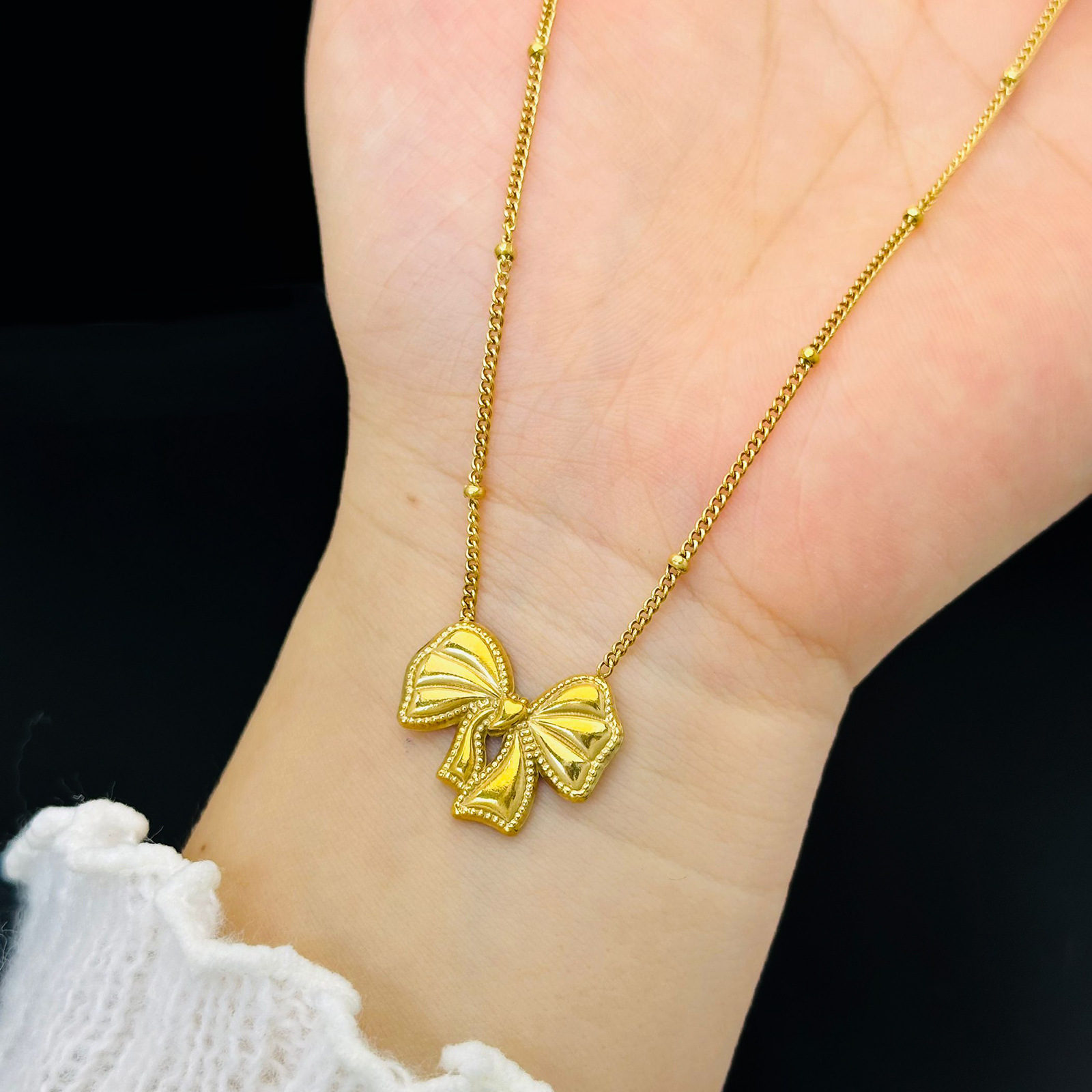 Bow set pendientes ligero lujoso estilo transfronterizo colgante de acero de titanio no decolor 18K joyas de oro ins