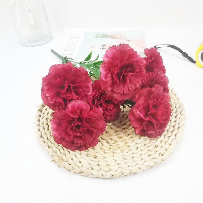 Xiaoyu Simulation Flower 7 Claveles Manlos de estilo europeo Ramo de claveles del día de la madre Paquete suave interior al por mayor