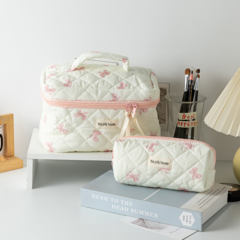 Capacious handheld cute cosmetic bag with bow for traveling
