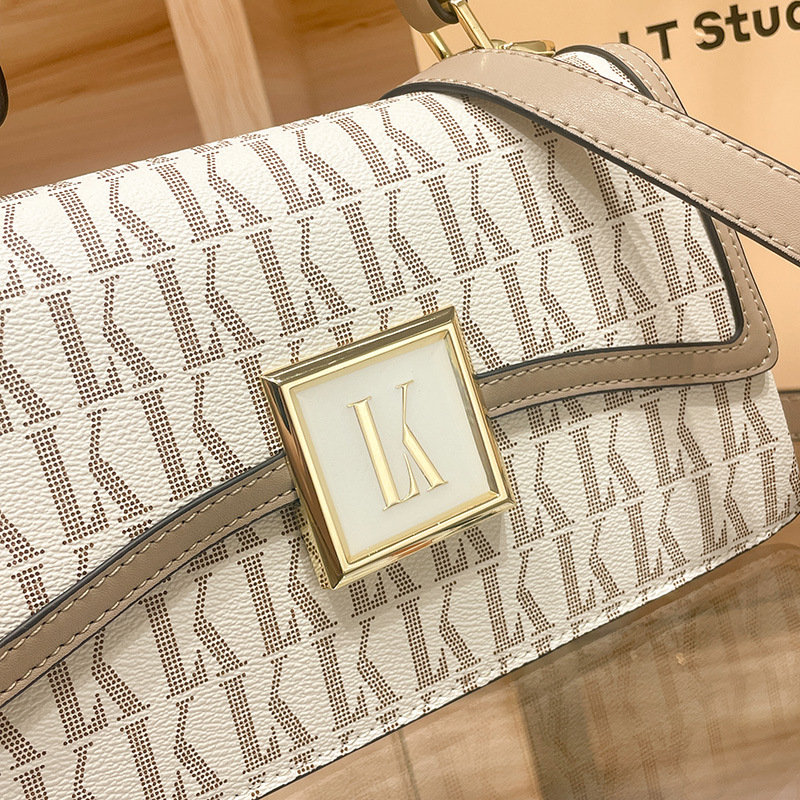 Hong Kong niche leisure leather square for crossbody versatile handheld one shoulder women's 2024 new small bag_voghion.com