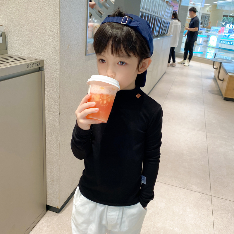 Ropa de otoño e invierno para niños nuevo estilo coreano color sólido camiseta de los muchachos medio cuello alto camisa de fondo para niñas engrosada bebé manga larga superior