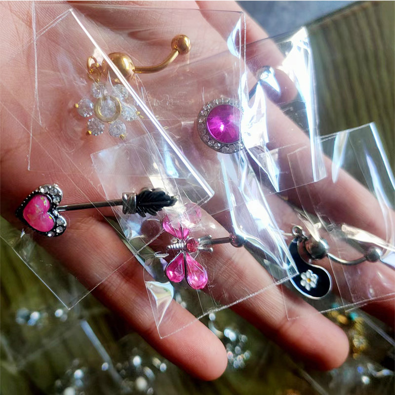 Fábrica de piercings para comércio eletrônico transfronteiriço, atacado de anéis de umbigo europeus e americanos, entrega aleatória de modelos personalizados e fáceis de usar._voghion.com