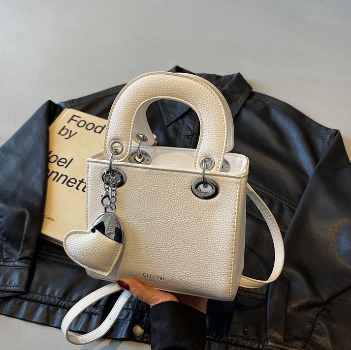 Bolso de mano de alta gama de comercio exterior para mujer 2025 nuevo bolso de hombro de todo fósforo de nicho de estilo occidental bolso de mensajero de moda