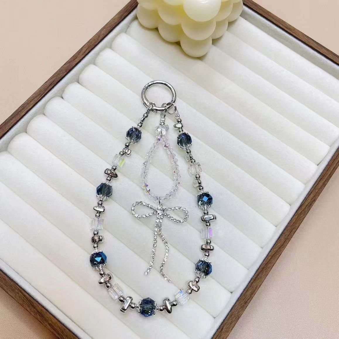 Lazo de lujo ligero, borla, cadena de teléfono móvil de cristal, cordón de muñeca, nueva cadena de nicho, exquisito colgante de alta gama