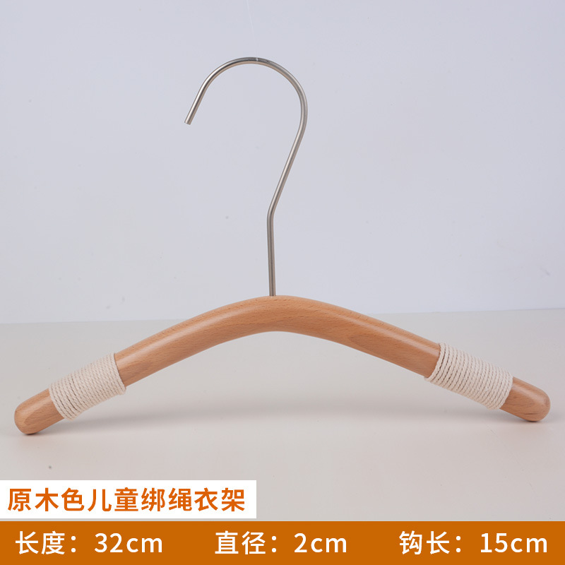 新しい子供の木のハンガーの韓国版の丸い棒のズボンは子供の実木のハンガーの服の店のケヤキの子供服のひものハンガーを挟みます。