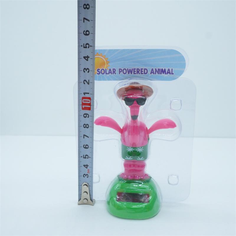 Venta caliente transfronteriza muebles oficina creativa flamenco balanceo animal sacudiendo la cabeza muñeca decoración de coche regalo de dibujos animados