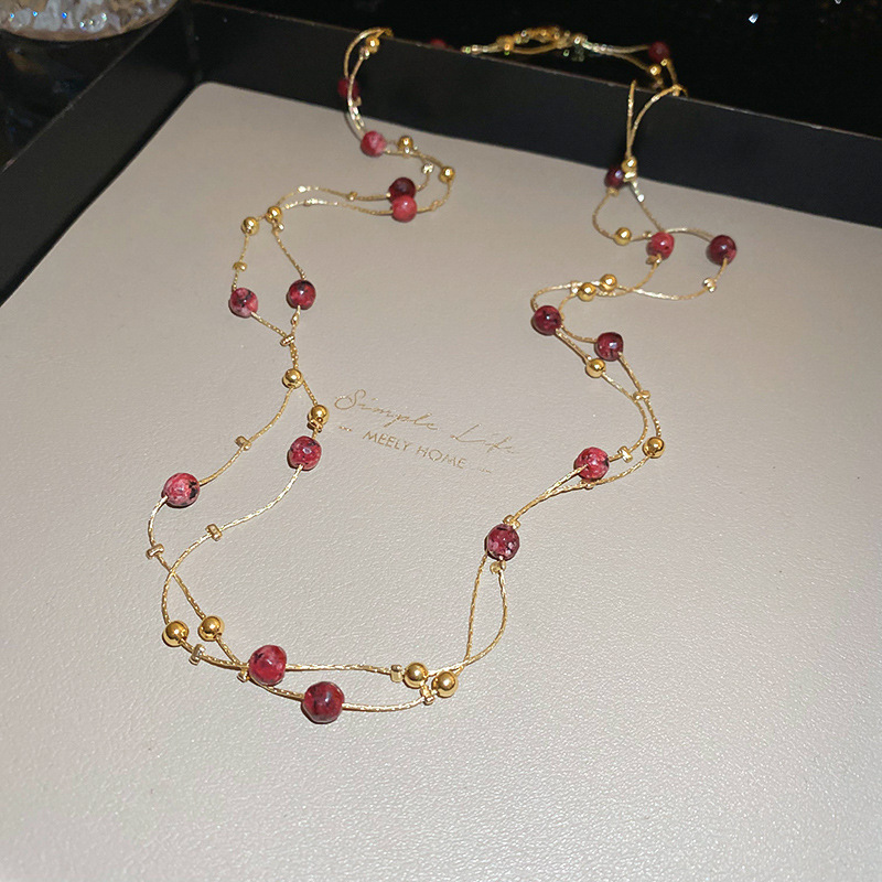 Collar con cuentas de perlas de gota de agua con diamantes transfronterizos otoño e invierno cadena de suéter de lujo ligero francés moda todo fósforo joyería de alta gama