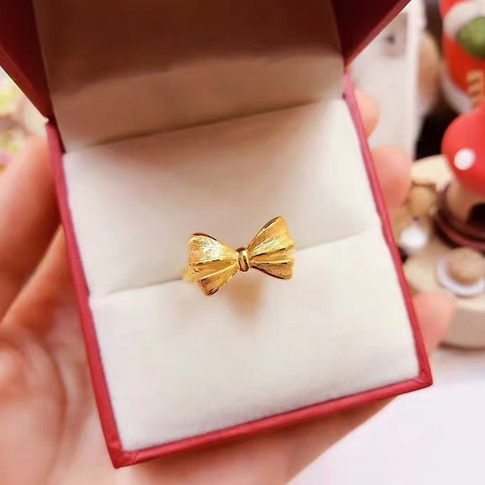 蝶結びの指輪の女性は黄金色の開口部をめっきして、口の麻の花の尾戒の指輪のシンプルなファッションの軽豪華さは色を落とさない。|undefined