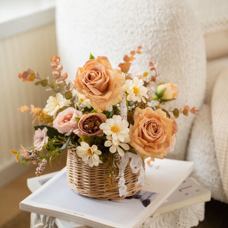 Pastoral-style autumn rose floral arrangement in a basket, perfect for a Wabi-Sabi-style guesthouse, coffee shop, entryway, or dining table as a decorative piece Pastoral-style autumn rose floral arrangement in a basket, perfect for a Wabi-Sabi-style guesthouse, coffee shop, entryway, or dining table as a decorative piece
