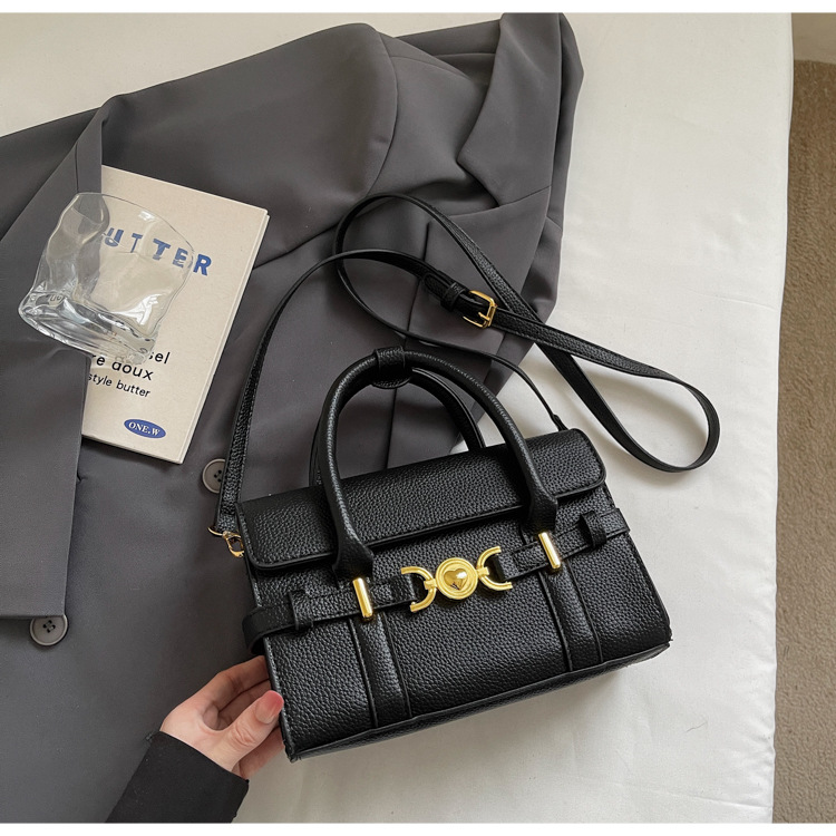 Alta textura de hardware decoración bolso de mano mujer 2026 nuevo popular litchi pattern casual versátil mochila