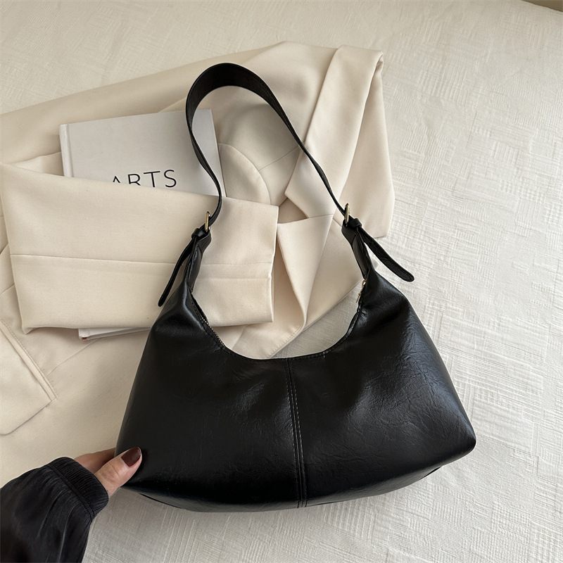 Nuevo diseño de nicho bolso de axila de piel de vaca otoño e invierno bolso de mensajero casual de un solo hombro bolso de baguette de moda para mujer