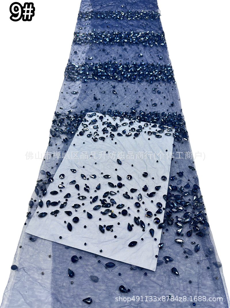 Tejido de malla de diamante de gota de agua laminada mano pesada clavos taladro de cola de pescado vestido de noche tela de boda en stock