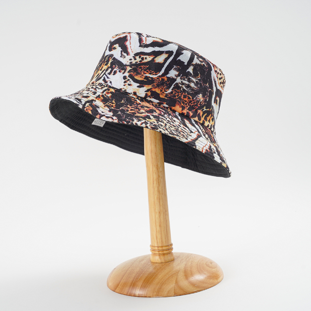 Nueva costura de doble cara sombrero de pescador de estampado de leopardo de moda hombres y mujeres de viaje de primavera y verano sombrero de la cuenca del estilo coreano
