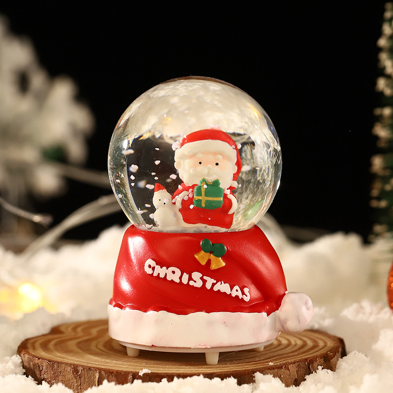 Una variedad de regalos de decoración de Navidad Navidad iluminante bola de cristal caja de música ventana diseño de velas lámparas de viento árbol de Navidad