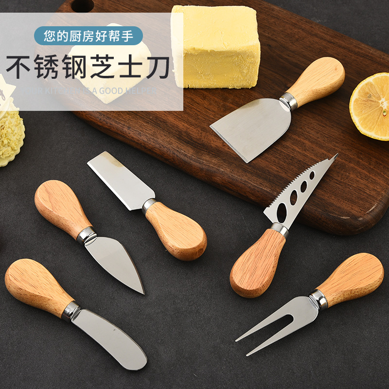 Fabricante de acero inoxidable cuchillo de queso de cuatro piezas conjunto de mango de madera de goma cuchillo de pizza de queso crema tenedor cuchillo de pala