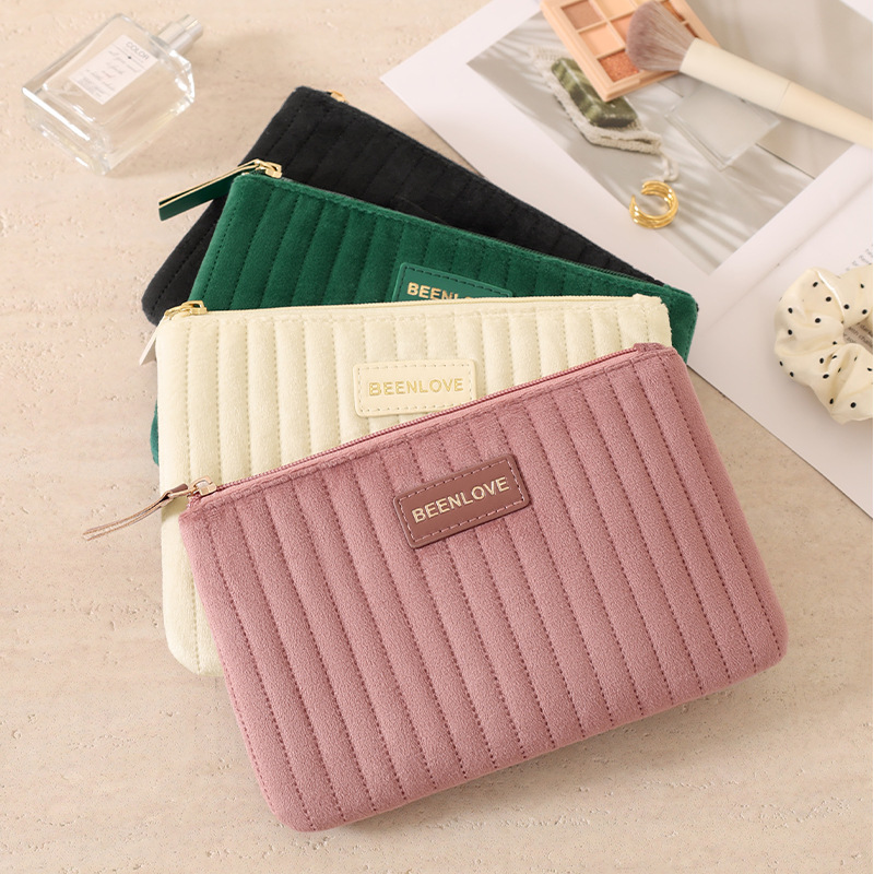 Nuevo paquete de maquillaje de terciopelo holandés transfronterizo de gran capacidad portátil para mujeres de alto valor de cosméticos de cuidado de la piel estriados bolsa de almacenamiento