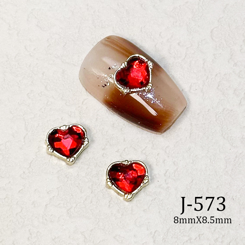 2023 Nueva joyería de uñas Año nuevo rojo aleación conejo rojo mariposa de cristal pintura en aerosol arco accesorios de diamantes de uñas